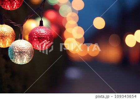 A lots of small Christmas balls decorated on night street light, vibrant color.GenerativeAI. 109343654