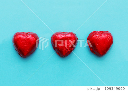 Three candies on a blue background. Three candies on a blue background. 109349090