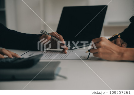 Businessman or job seeker review his resume on his desk before send to finding a new job with pen, necktie, glasses and digital tablet. Businessman or job seeker review his resume on his desk before send to finding a new job with pen, necktie, glasses and digital tablet. 109357261
