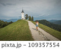 Jamnik, Slovenia. The Jamnik Church is a charming 15th-century chapel in the Kamnik-Savinja Alps near Kranj, breathtaking views of the surrounding mountainous landscape. The Church of St. Primoz 109357554