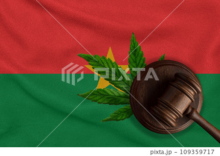 Flag of Burkina Faso and justice gavel with cannabis leaf. Illegal growth of cannabis plant and drugs spreading Flag of Burkina Faso and justice gavel with cannabis leaf. Illegal growth of cannabis plant and drugs spreading 109359717