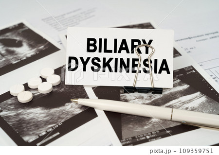 On the ultrasound pictures there is a pen and a business card with the inscription - Biliary dyskinesia 109359751