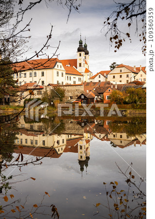 Telc town with lake on foregrund - autumn landscape Telc town with lake on foregrund - autumn landscape 109360359
