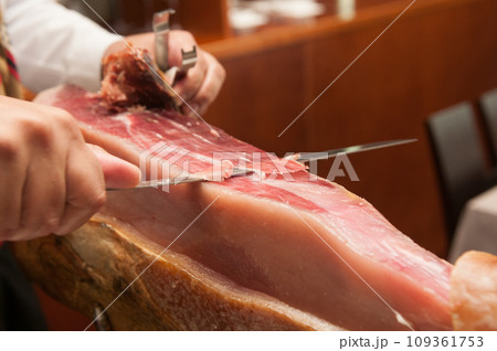 Cutting Jamon Serrano - traditional spanish ham 109361753