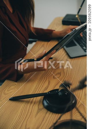Lawyer, legal advisor, businessman brainstorming information on agreement details Business contracts in legal processing books for accuracy in contract documents. joint financial investment. 109362099