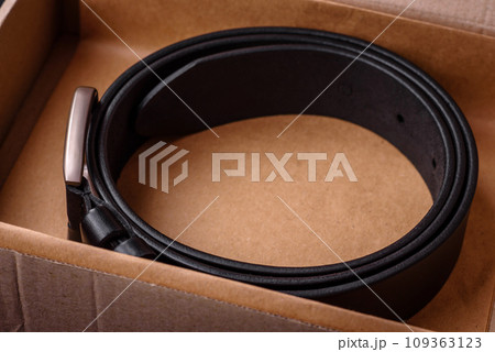 New leather men's belt with an old-style metal buckle New leather men's belt with an old-style metal buckle 109363123