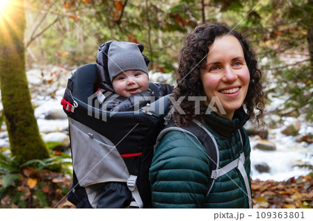 Mother Hiking with Baby in Backpack Carrier in Canadian Nature. Mother Hiking with Baby in Backpack Carrier in Canadian Nature. 109363801