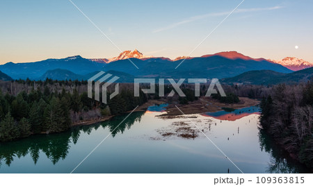 Canadian Mountain Landscape, peaceful river with green trees. Sunny Sunset. 109363815