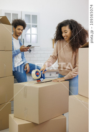 moving to new apartment relocation. happy couple an African American man and woman 109365074