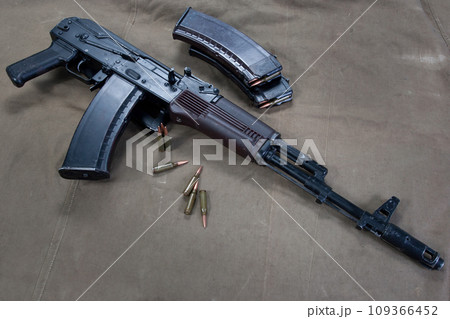 Kalashnikov AK on khaki green canvas 109366452