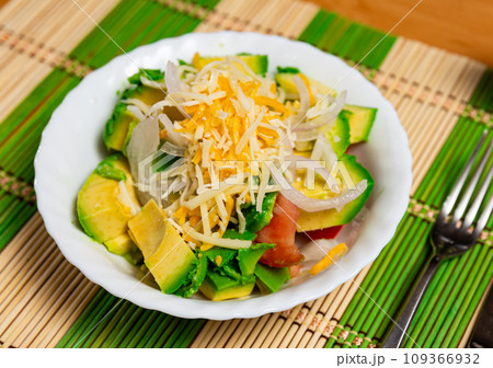 Salad with avocado, tomatoes, onions and cheese Salad with avocado, tomatoes, onions and cheese 109366932