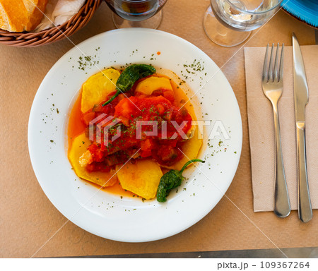 Fried cod fillet served with samfaina Fried cod fillet served with samfaina 109367264
