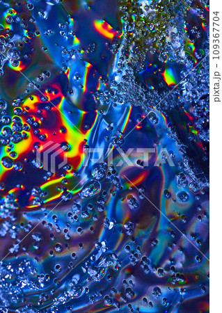 Bright abstract art with bubbles flowing across colorful oily surface background asset 109367704
