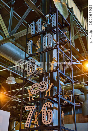 Tall clock tower with mechanical people moving numbers six through eleven Tall clock tower with mechanical people moving numbers six through eleven 109367983