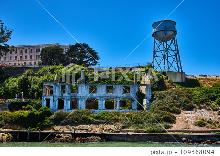 Close up view of Alcatraz Island with abandoned building and water tower 109368094