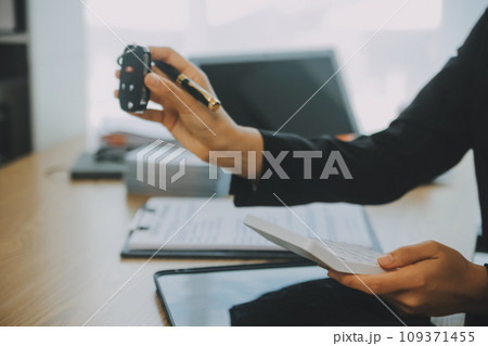 Salesman send key to customer after good deal agreement, successful car loan contract buying or selling new vehicle. 109371455