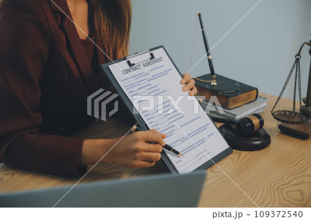 Lawyer, legal advisor, businessman brainstorming information on agreement details Business contracts in legal processing books for accuracy in contract documents. joint financial investment. Lawyer, legal advisor, businessman brainstorming information on agreement details Business contracts in legal processing books for accuracy in contract documents. joint financial investment. 109372540