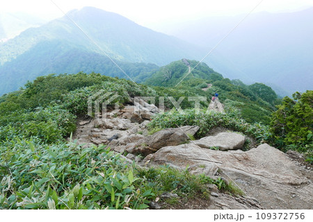 Mount Tanigawa is One of Japanese famous 100 mountains. Mount Tanigawa, Tanigawadake is a craggy, rugged mountain found on the border of Gunma and Niigata prefectures in northern Minakami. Mount Tanigawa is One of Japanese famous 100 mountains. Mount Tanigawa, Tanigawadake is a craggy, rugged mountain found on the border of Gunma and Niigata prefectures in northern Minakami. 109372756