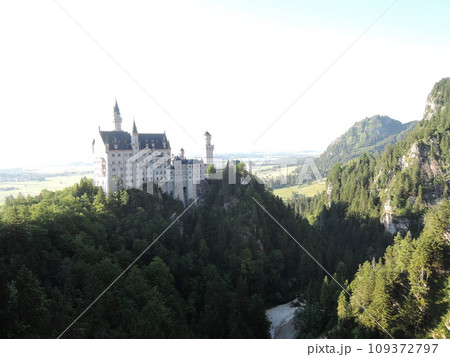 Neuschwanstein Castle is a 19th century historicist palace on a rugged hill above the village of Hohenschwangau near Fussen in southwest Bavaria, Germany. 109372797