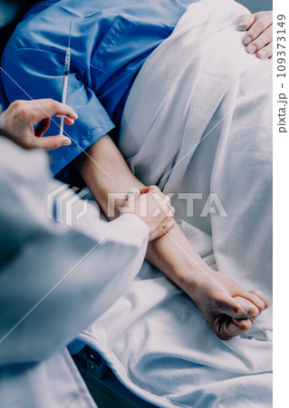Doctor telling to patient woman the results of her medical tests. Doctor showing medical records to cancer patient in hospital ward. Senior doctor explaint the side effects of the intervention. 109373149