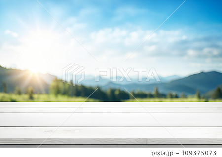 Empty wood tabletop or counter with display product. Blur image of blue sky and hill background. Display product background Empty wood tabletop or counter with display product. Blur image of blue sky and hill background. Display product background 109375073