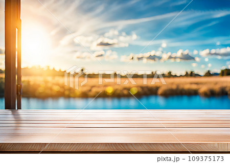 Empty wood tabletop or counter with display product. Blur image of blue sky and hill background. Display product background Empty wood tabletop or counter with display product. Blur image of blue sky and hill background. Display product background 109375173