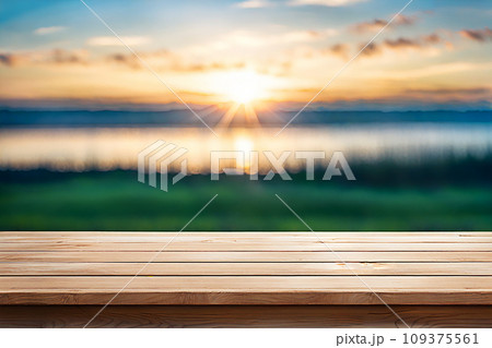 Empty wood tabletop or counter with display product. Blur image of blue sky and hill background. Display product background Empty wood tabletop or counter with display product. Blur image of blue sky and hill background. Display product background 109375561