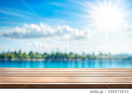 Empty wood tabletop or counter with display product. Blur image of blue sky and hill background. Display product background Empty wood tabletop or counter with display product. Blur image of blue sky and hill background. Display product background 109375613
