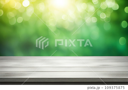 Empty wood tabletop or counter with display product. Blur image of green leaves bokeh background. Display product background concept 109375875