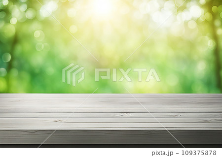 Empty wood tabletop or counter with display product. Blur image of green leaves bokeh background. Display product background concept Empty wood tabletop or counter with display product. Blur image of green leaves bokeh background. Display product background concept 109375878