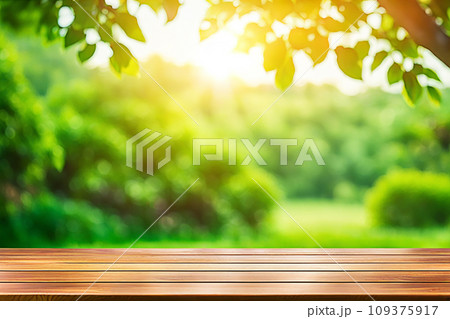 Empty wood tabletop or counter with display product. Blur image of green leaves bokeh background. Display product background concept Empty wood tabletop or counter with display product. Blur image of green leaves bokeh background. Display product background concept 109375917