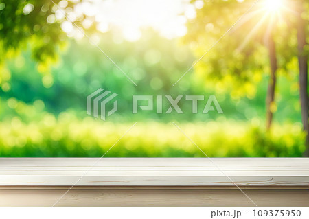 Empty wood tabletop or counter with display product. Blur image of green leaves bokeh background. Display product background concept Empty wood tabletop or counter with display product. Blur image of green leaves bokeh background. Display product background concept 109375950