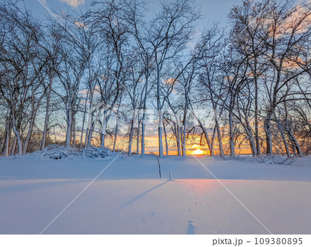 Country winter landscape at sunset Country winter landscape at sunset 109380895