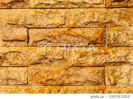 Background Sandstone patterned walls in my house. 109381020