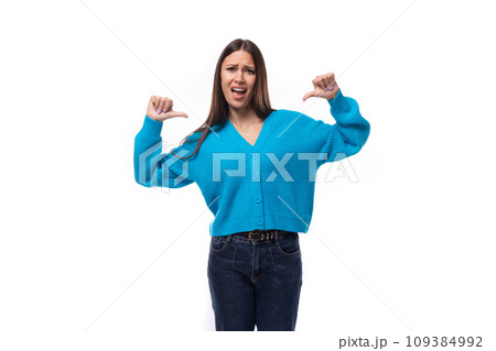 active stylish young brunette lady dressed in blue casual sweater 109384992