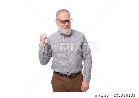 stylish mature gray-haired office worker man with a mustache and beard dressed in trousers and a stylish mature gray-haired office worker man with a mustache and beard dressed in trousers and a 109386133