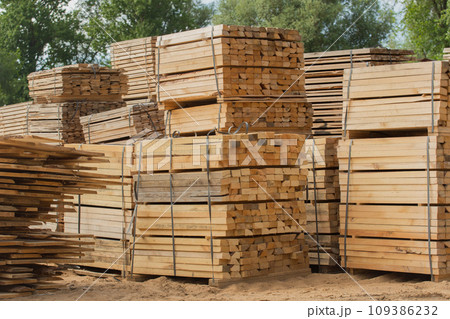 Wood stack storage timber wooden materials lumber pile industry outdoor warehouse stock 109386232