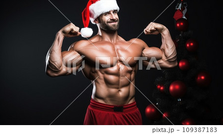 Santa Claus fitness trainer. A muscular man in a gym Santa Claus fitness trainer. A muscular man in a gym 109387183