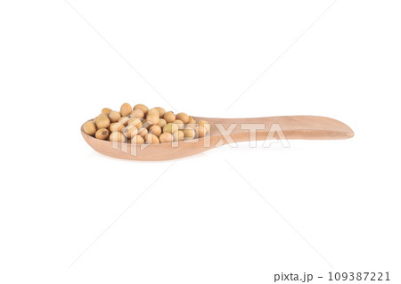 Soybean seeds in wooden spoon isolated on white background 109387221