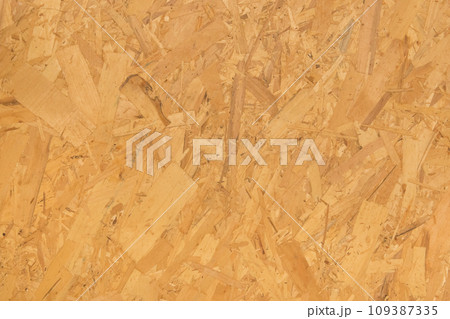 Chipboard light yellow osb surface pressed wood pattern texture particleboard background construction material 109387335