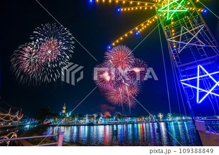 Colorful lights in the outdoor amusement park at night, Temple fair is an annual traditional festival, There is a place for religious ceremonies, Thai traditional food, and a local theme park. 109388849