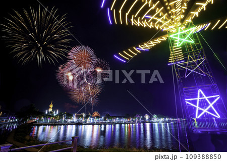 Colorful lights in the outdoor amusement park at night, Temple fair is an annual traditional festival, There is a place for religious ceremonies, Thai traditional food, and a local theme park. 109388850