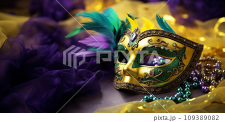 Mardi gras carnival concept - green, yellow and purple mask with decorations Mardi gras carnival concept - green, yellow and purple mask with decorations 109389082