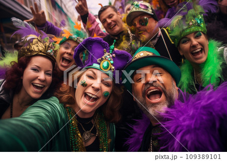 Mardi gras concept - happy people celebrate and dance during the parade outside 109389101