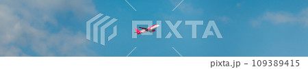 Airplane Of Airlines Flying In cloudy Sky panorama 109389415