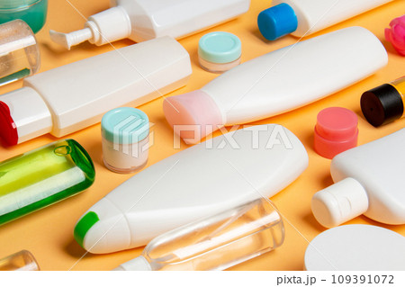Group of plastic bodycare bottle Flat lay composition with cosmetic products on colored background empty space for you design. Set of White Cosmetic containers, top view with copy space Group of plastic bodycare bottle Flat lay composition with cosmetic products on colored background empty space for you design. Set of White Cosmetic containers, top view with copy space 109391072