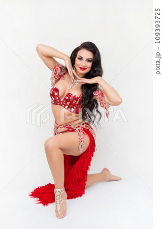Portrait of the head of a female oriental dance studio, red dress, white background 109393725