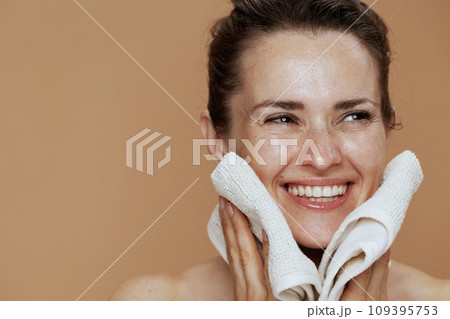 happy modern woman with towel washing face happy modern woman with towel washing face 109395753