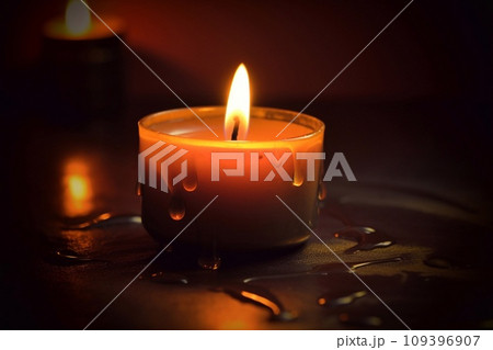 Burning candle on dark background, space for text. Memory day 109396907