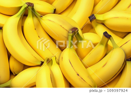 Organic yellow bananas, ripe and abundant. Freshness and nutrition in a full frame capture. 109397924